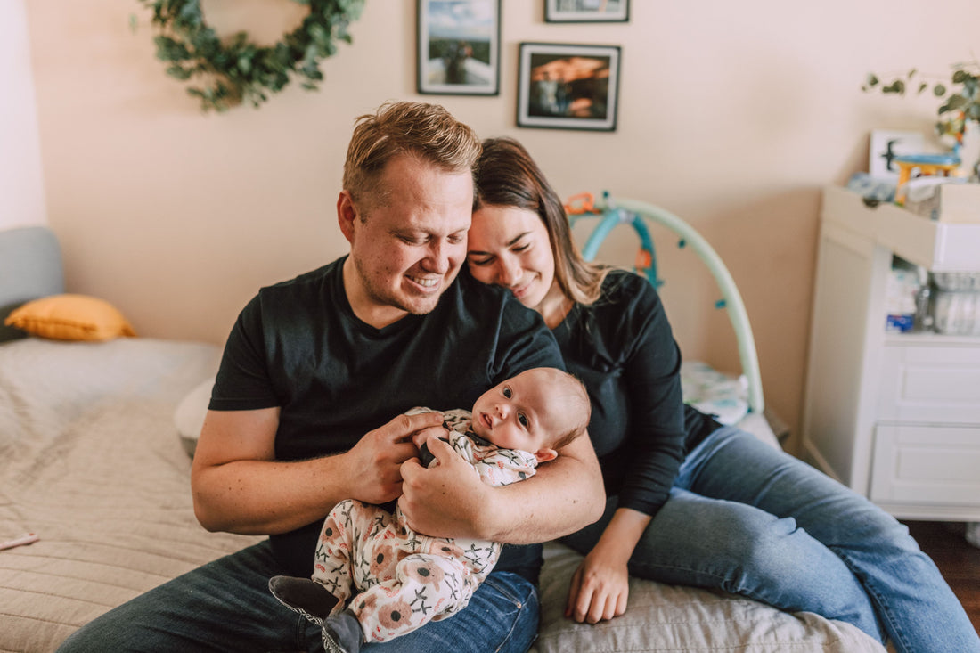 Parents with newborn baby at home on first night