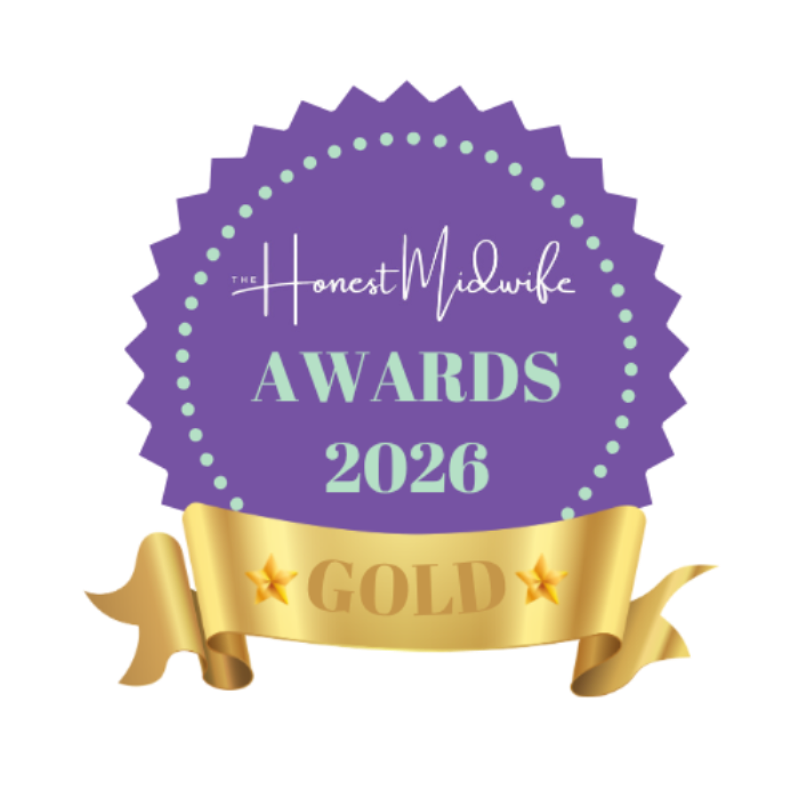 A digital graphic of a purple and gold award badge for 'The Honest Midwife Awards 2026'. The badge is purple with a scalloped edge, featuring white and light green text, and is topped with a shiny gold ribbon banner labeled 'GOLD'.