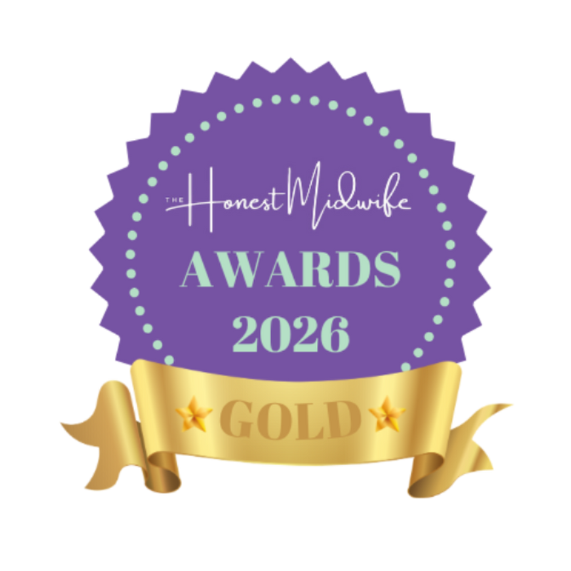A digital graphic of a purple and gold award badge for 'The Honest Midwife Awards 2026'. The badge is purple with a scalloped edge, featuring white and light green text, and is topped with a shiny gold ribbon banner labeled 'GOLD'.